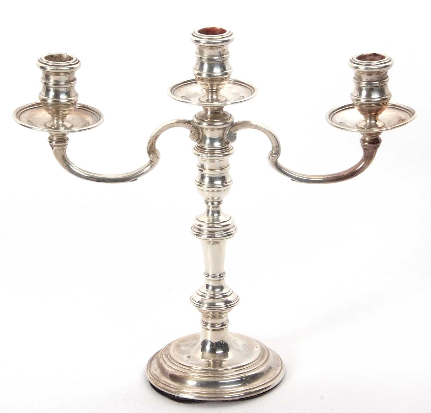 Lot 98 - A silver three light candelabra standing on a...