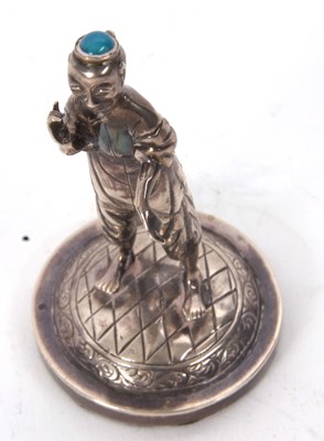 Lot 128 - A Chinese export white metal figure of a...