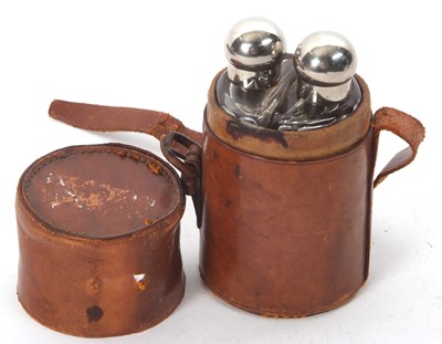 Lot 129 - A vintage leather travel case double glass...