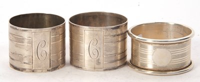 Lot 163 - A pair of George VI silver serviette rings,...