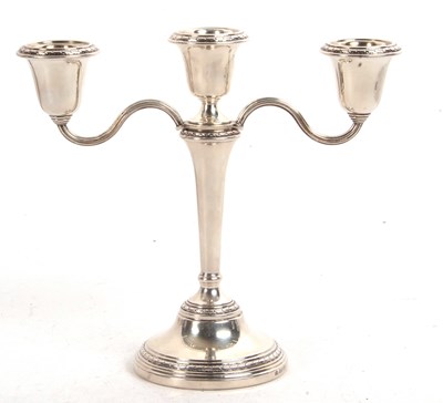 Lot 182 - An Elizabeth II silver three branch candelabra,...