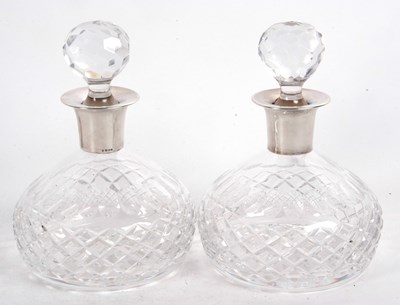 Lot 186 - A pair of heavy cut glass decanters of slight...