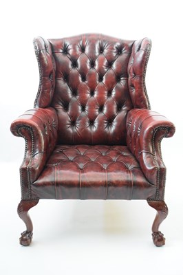 Lot 258 - 20th century red buttoned leather wingback...