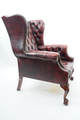 Lot 258 - 20th century red buttoned leather wingback...