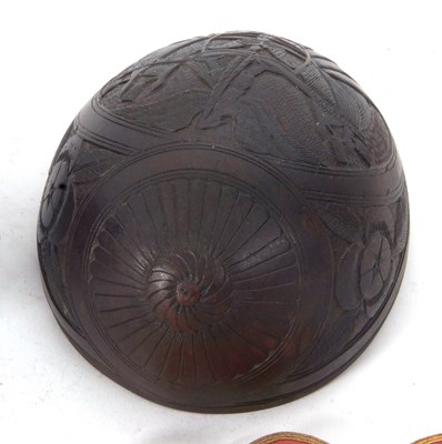 Lot 229 - Two parts of a coconut shell, one antique with...