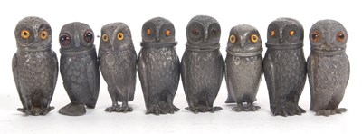 Lot 230 - A group of eight pewter novelty screw top owl...