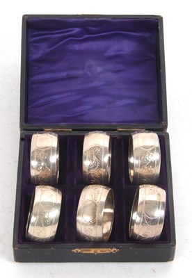 Lot 246 - Cased set of six matching silver serviette...