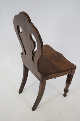 Lot 276 - Victorian oak hall chair, the shaped pierced...