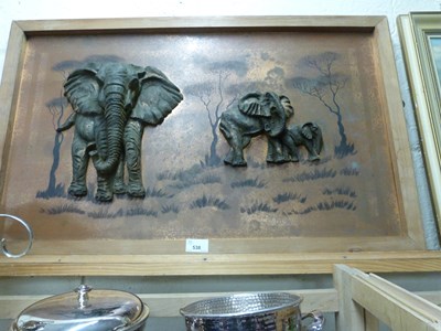 Lot 538 - A coppered relief moulded picture of elephants...
