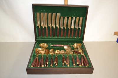 Lot 196 - Canteen of brass and wood mounted cutlery