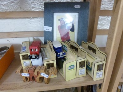 Lot 631 - Quantity of toy vans together with a picture...