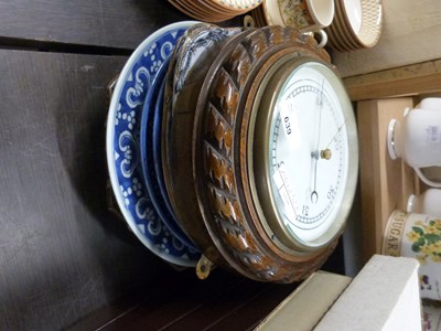 Lot 639 - An oak cased wall mounted barometer and a...