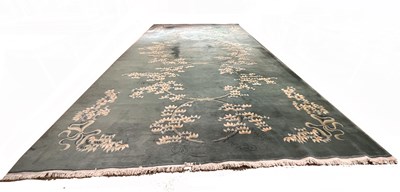 Lot 428A - Large contemporary Chinese green ground carpet...