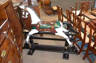 Lot 624 - Modern rocking horse on a black painted stand,...