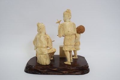 Lot 2 - Okimono of a Japanese family with two children...