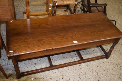 Lot 299 - Reproduction oak coffee table on stretcher...