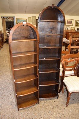 Lot 343 - Two 20th Century bow topped narrow bookcase...