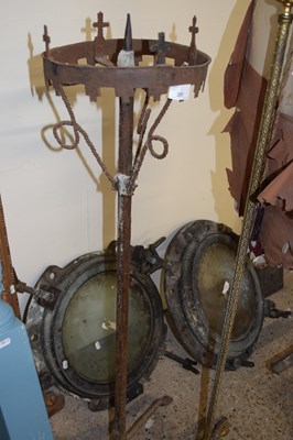 Lot 391 - Floor standing iron candle holder with...