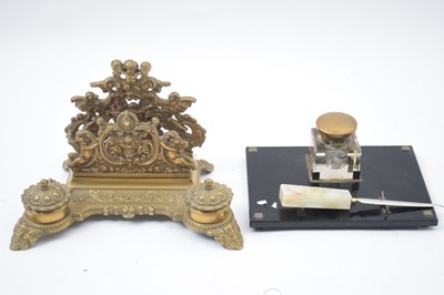 Lot 303 - Cast brass desk stand of decorative form...