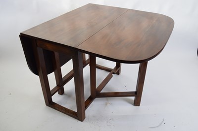 Lot 317 - 20th century mahogany drop leaf dining table,...