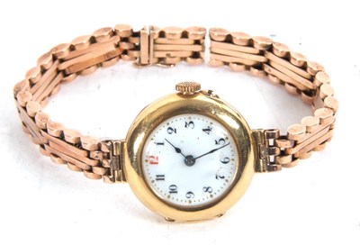 Lot 325 - An 18ct gold lady's wristwatch on a yellow...