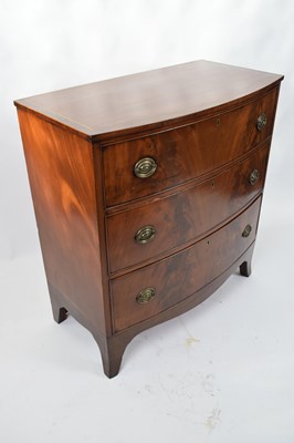 Lot 324 - Late Georgian mahogany bow front chest of...