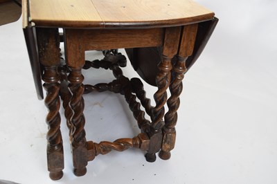 Lot 329 - Large 18th century oak dining table, the oval...