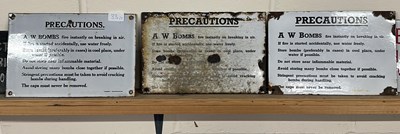 Lot 33 - Three enamelled "A W Bombs Precautions" notices