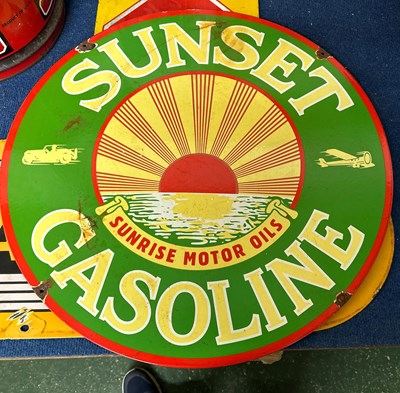 Lot 47 - A circular double sided enamel sign "For...