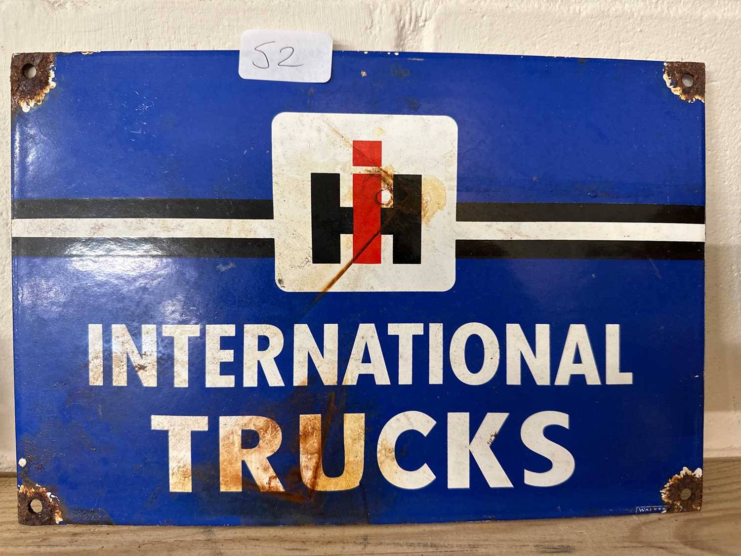 Lot 52 - A reproduction enamel sign for "International...