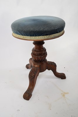Lot 323 - Victorian walnut framed revolving piano stool...
