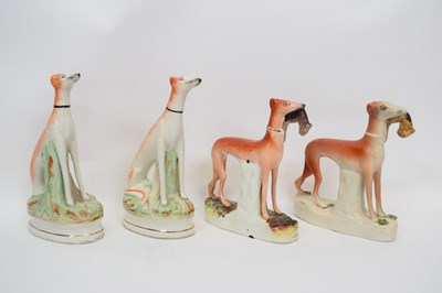 Lot 50 - Pair of Staffordshire greyhounds with rabbits...
