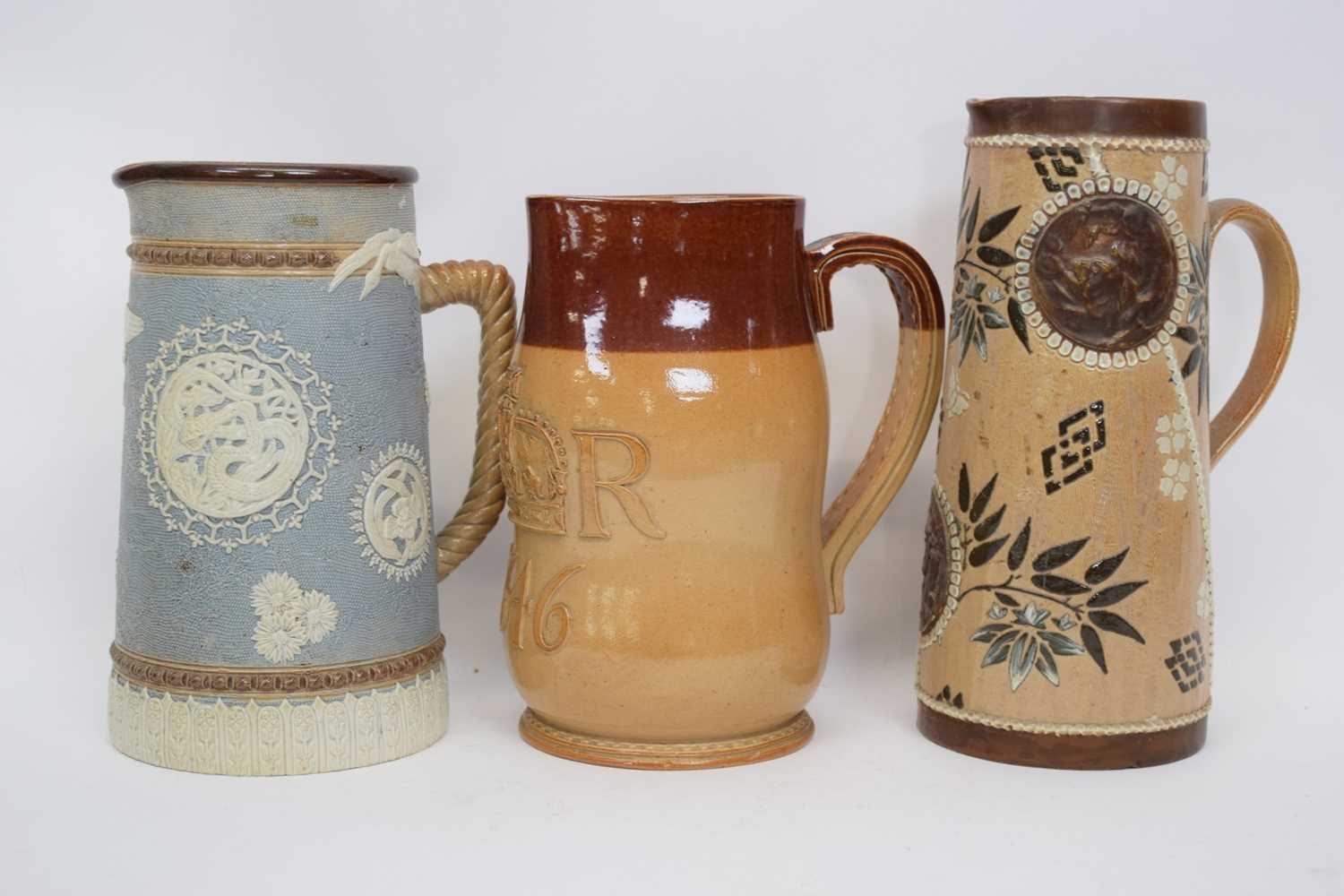 Lot 82 - Group of three Doulton ware jugs including one...