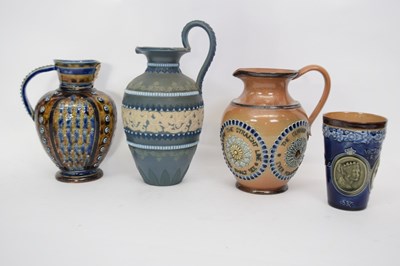 Lot 91 - Group of three Doulton ware jugs including one...