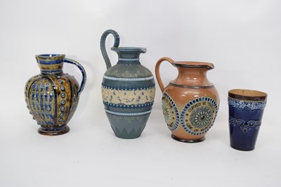 Lot 91 - Group of three Doulton ware jugs including one...