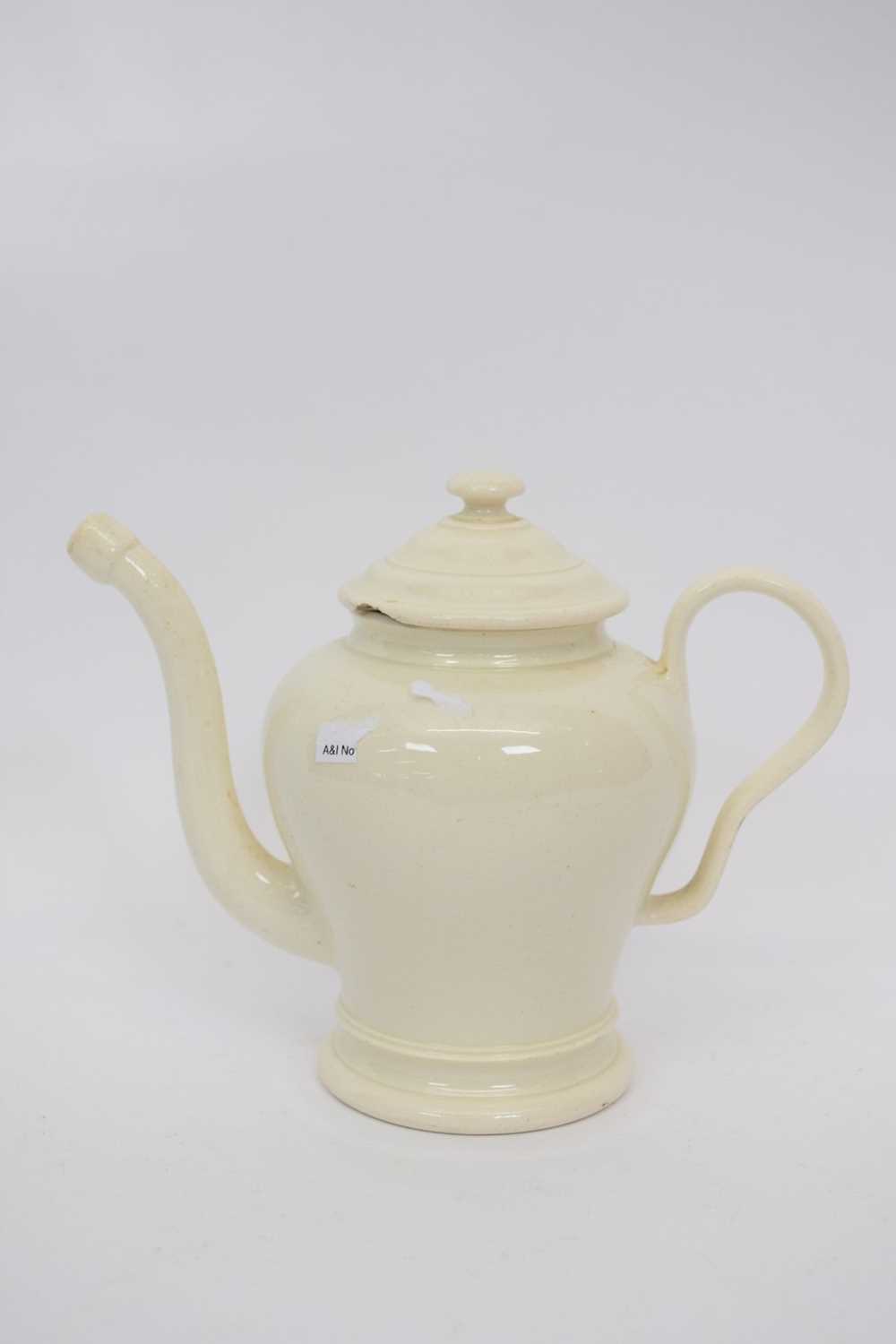 Lot 114 - Small cream ware tea pot with unusual spout,...