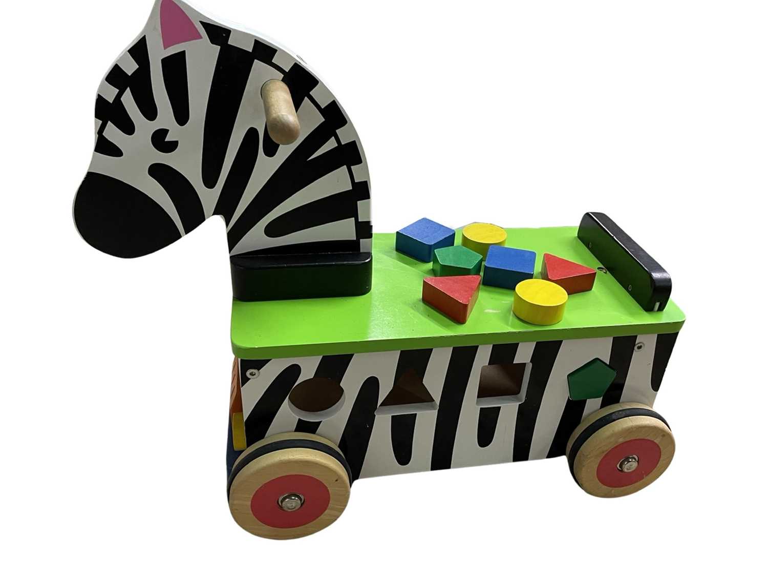 Lot 138 A ride on wooden zebra, with inbuilt shapes
