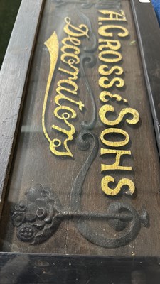 Lot 61 - A framed wooden sign with raised lettering...