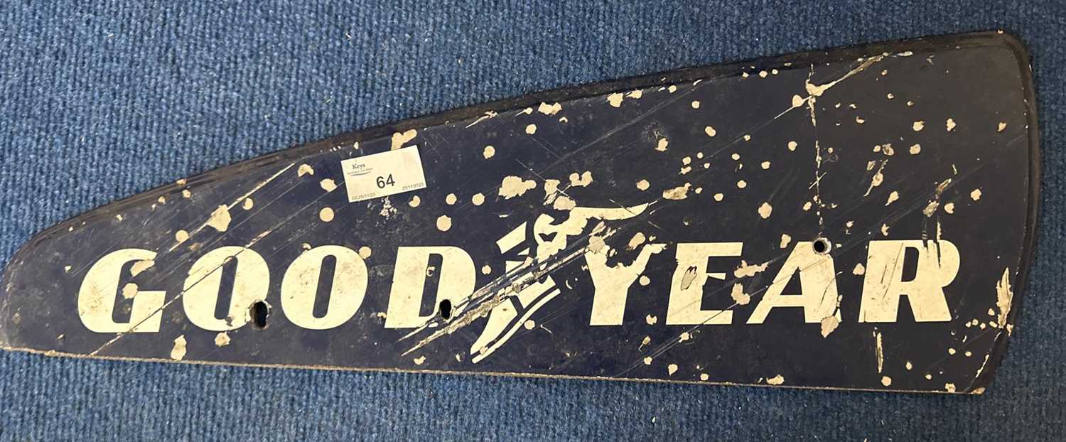 Lot 64 - A painted plywood sign marked Goodyear, 51cm wide