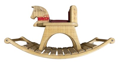 Lot 139 - A small modern wooden rocking horse with red...