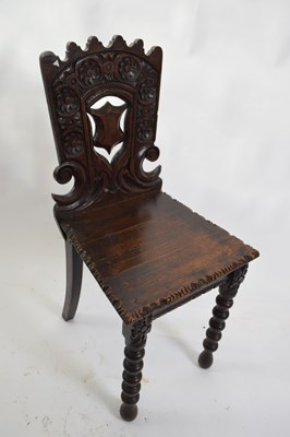 Lot 341 - Victorian oak Gothic carved hall chair with...
