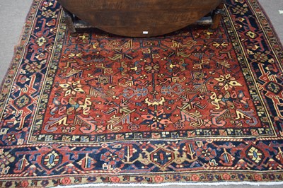 Lot 377 - 20th century Heriz wool floor rug decorated...