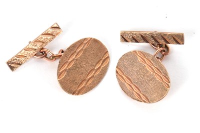 Lot 100 - A pair of 9ct cufflinks, the oval discs with...