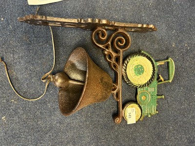 Lot 143 - Reproduction cast metal wall bell with tractor...