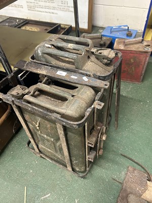 Lot 191 - Two vintage jerry cans with transport cages