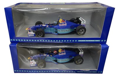 Lot 223 - A pair of 1:18 scale boxed Onyx racing cars,...