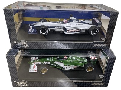 Lot 213 - A pair of 1:18 scale boxed Hotwheels car...