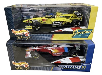 Lot 216 - A pair of boxed Hotwheels 1:18 scale model...