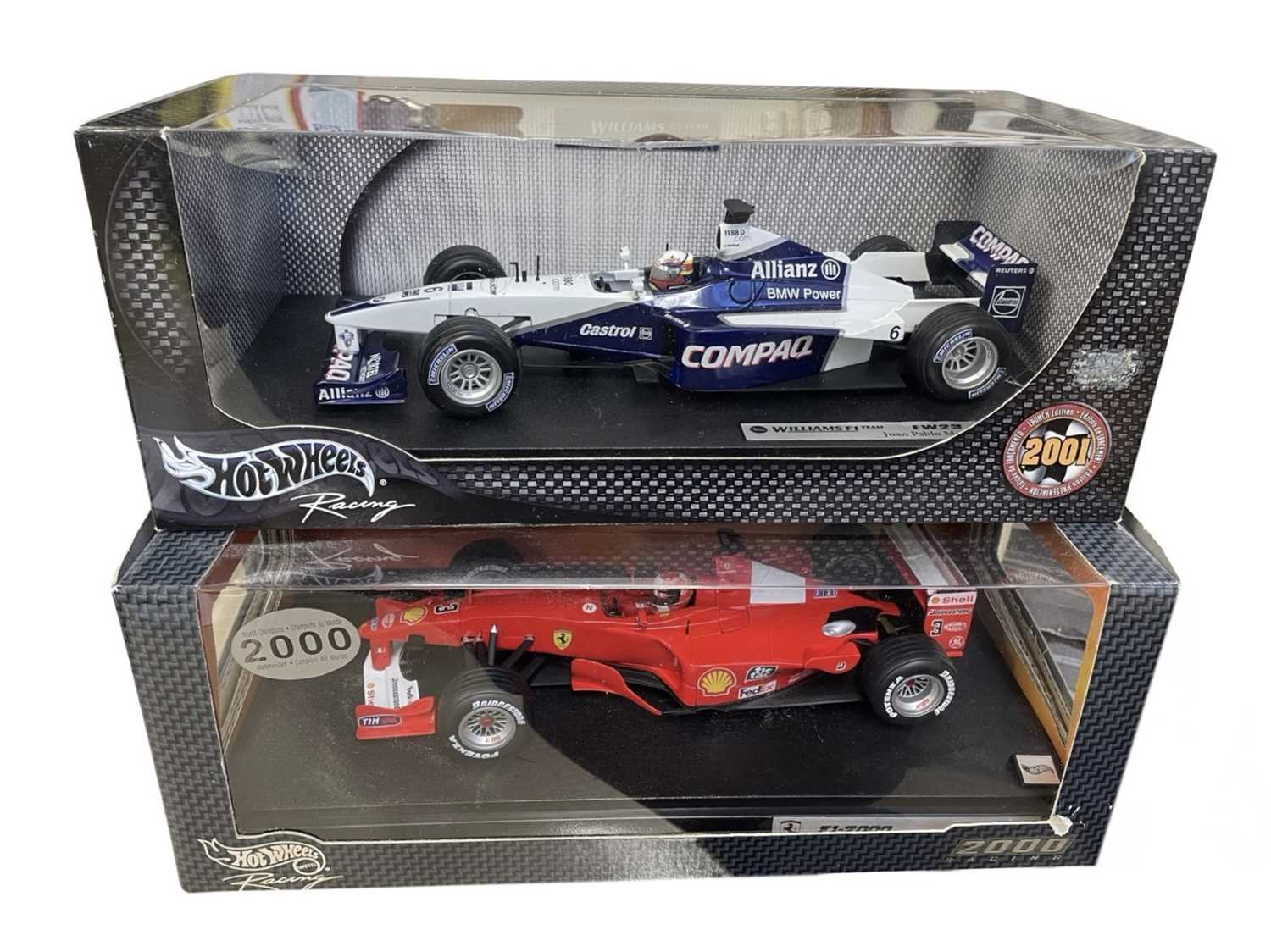 Lot 215 - A pair of boxed Hotwheels 1:18 scale model...
