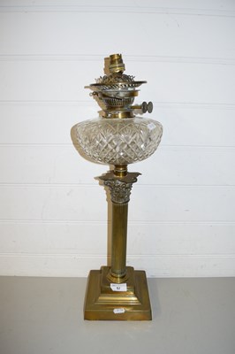 Lot 57 - OIL LAMP, CLEAR GLASS FONT AND A BRASS...